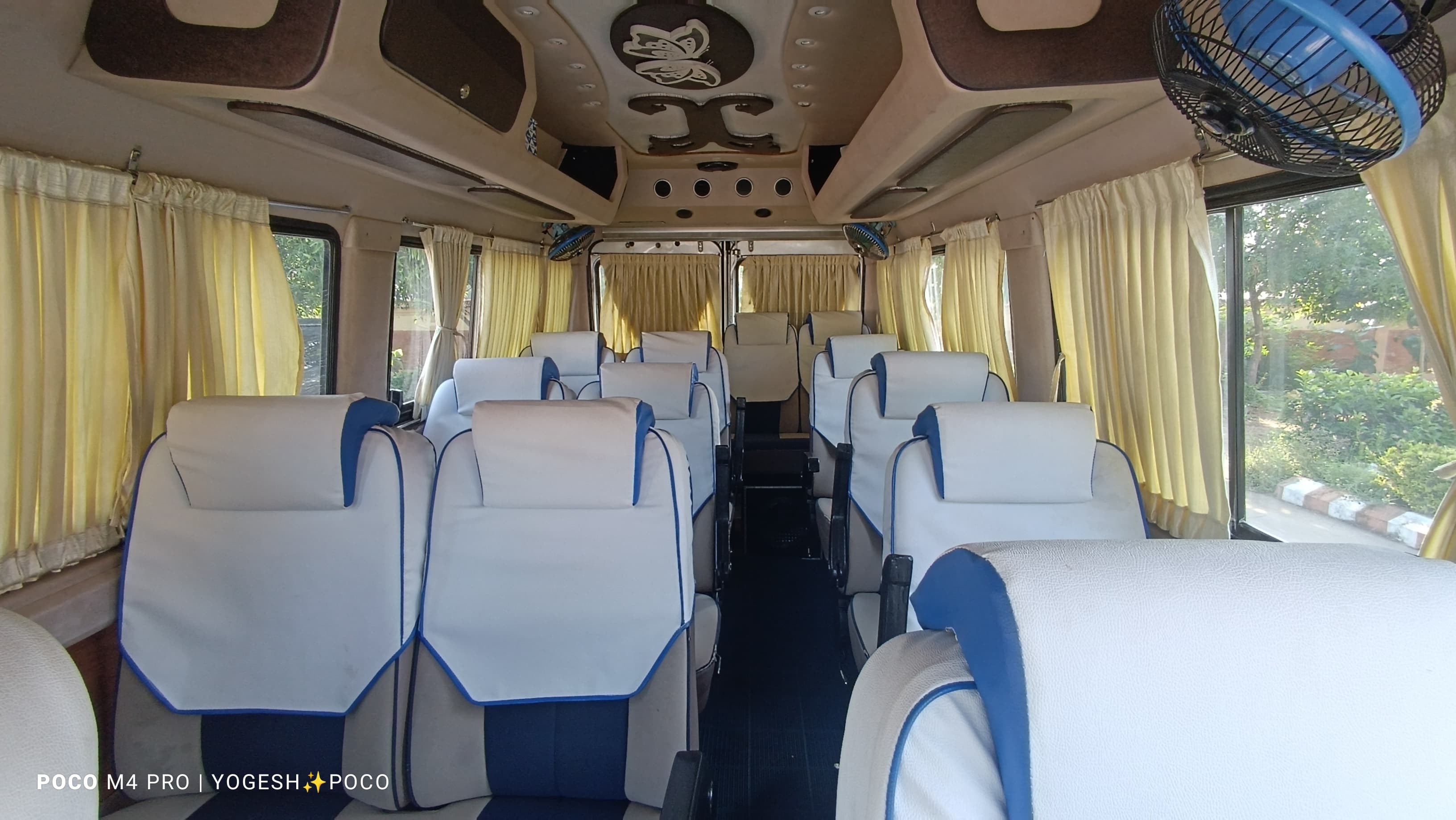 Wide interior view of 12-seater Tempo Traveller