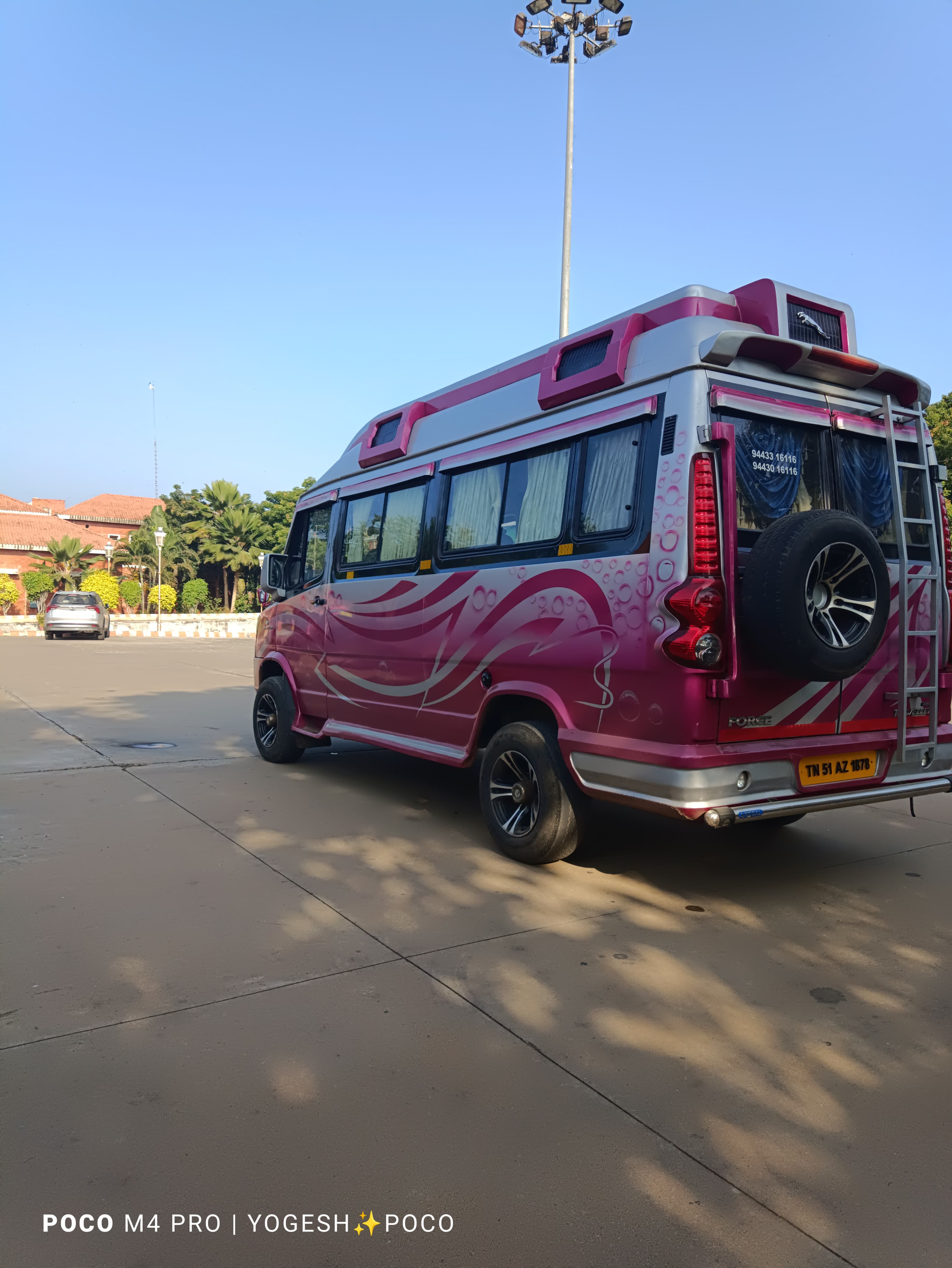 Full side profile of Tempo Traveller in daylight